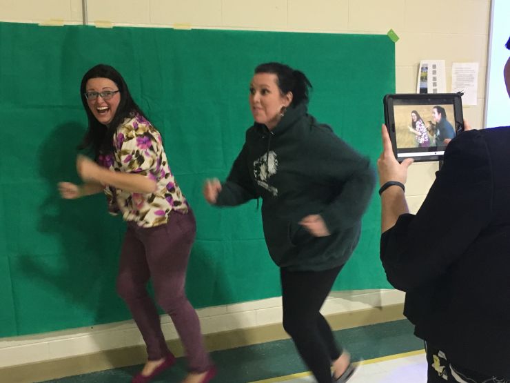 Two teachers have fun with greenscreen technology 