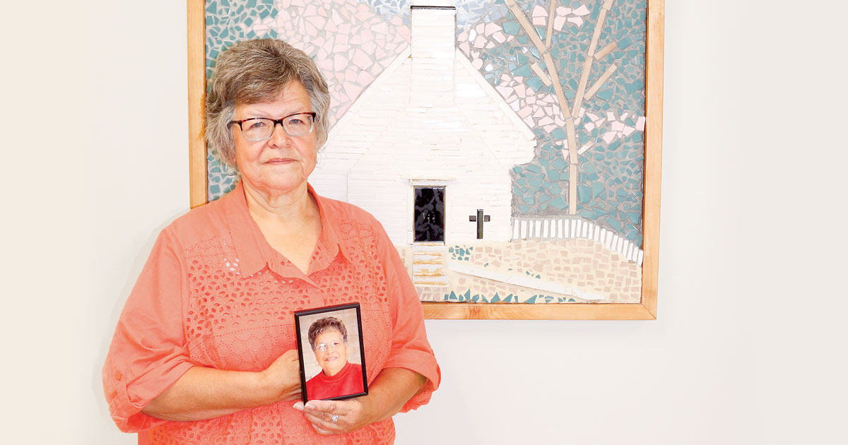 Claudine VanEvery-Albert holds a photo of her mother Mary