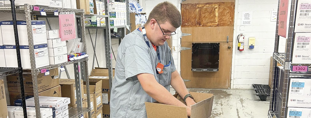 A Project | SEARCH student working in a warehouse storage environment