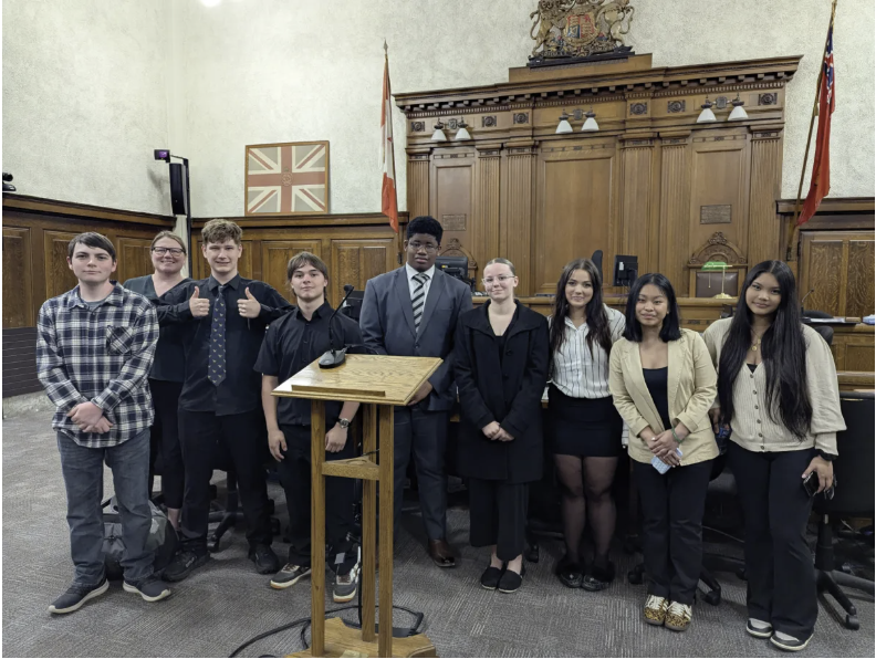 Cayuga Secondary School mooting competition team posing in courtroom