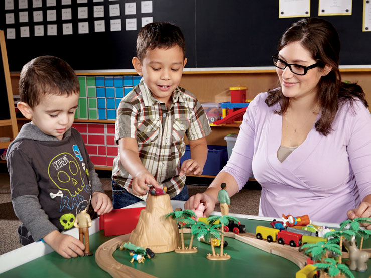 Students playing with toy trains