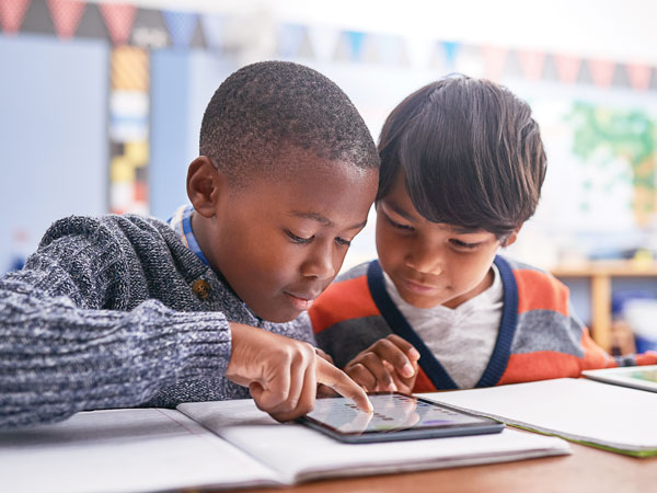 Students working on an iPad