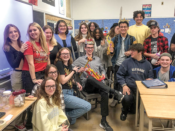 Students smiling in a class room