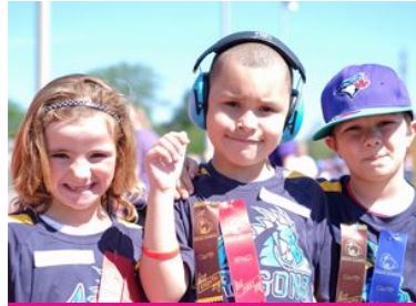 one children listen music and two others look at the camera