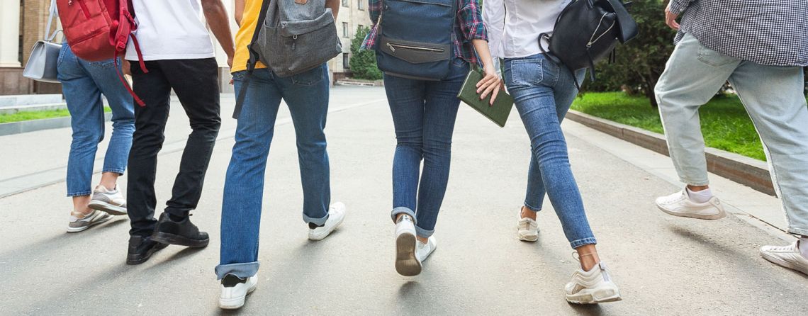 Students are walking and picture was taken behind them