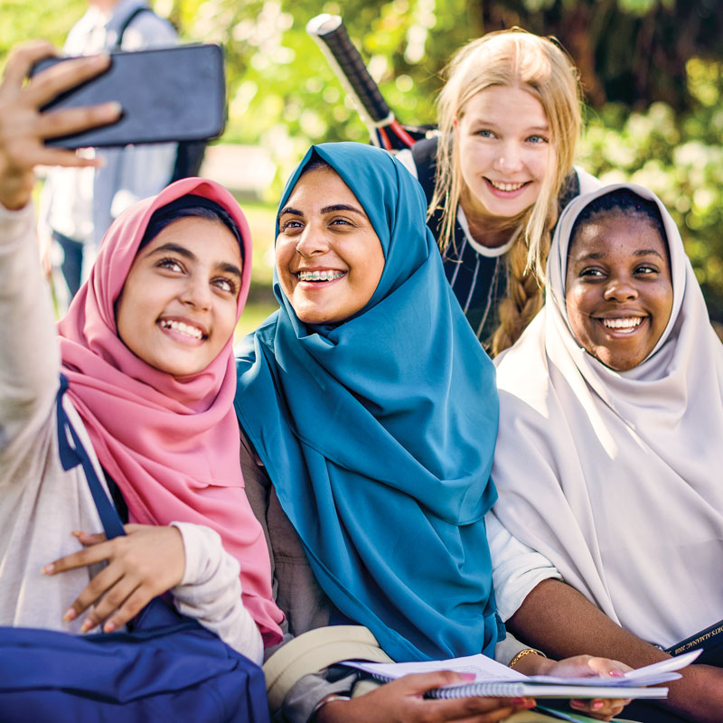 Students taking a picture outside