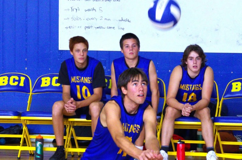 BCI Garcia Pucci returns serve during AABHN senior boys volleyball game against McKinnon Park