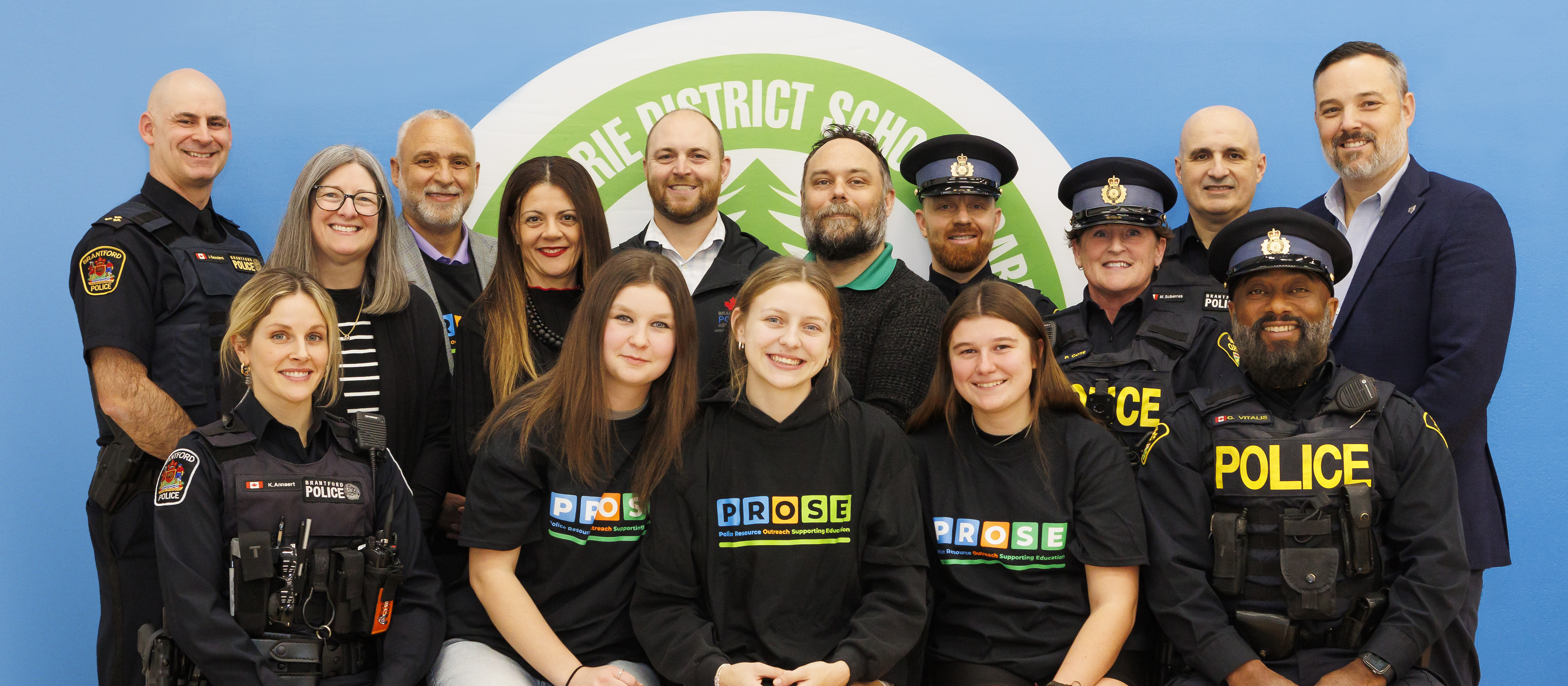 A group photo featuring members of the Grand Erie District School Board, Brantford Police Service, Ontario Provincial Police and students.
