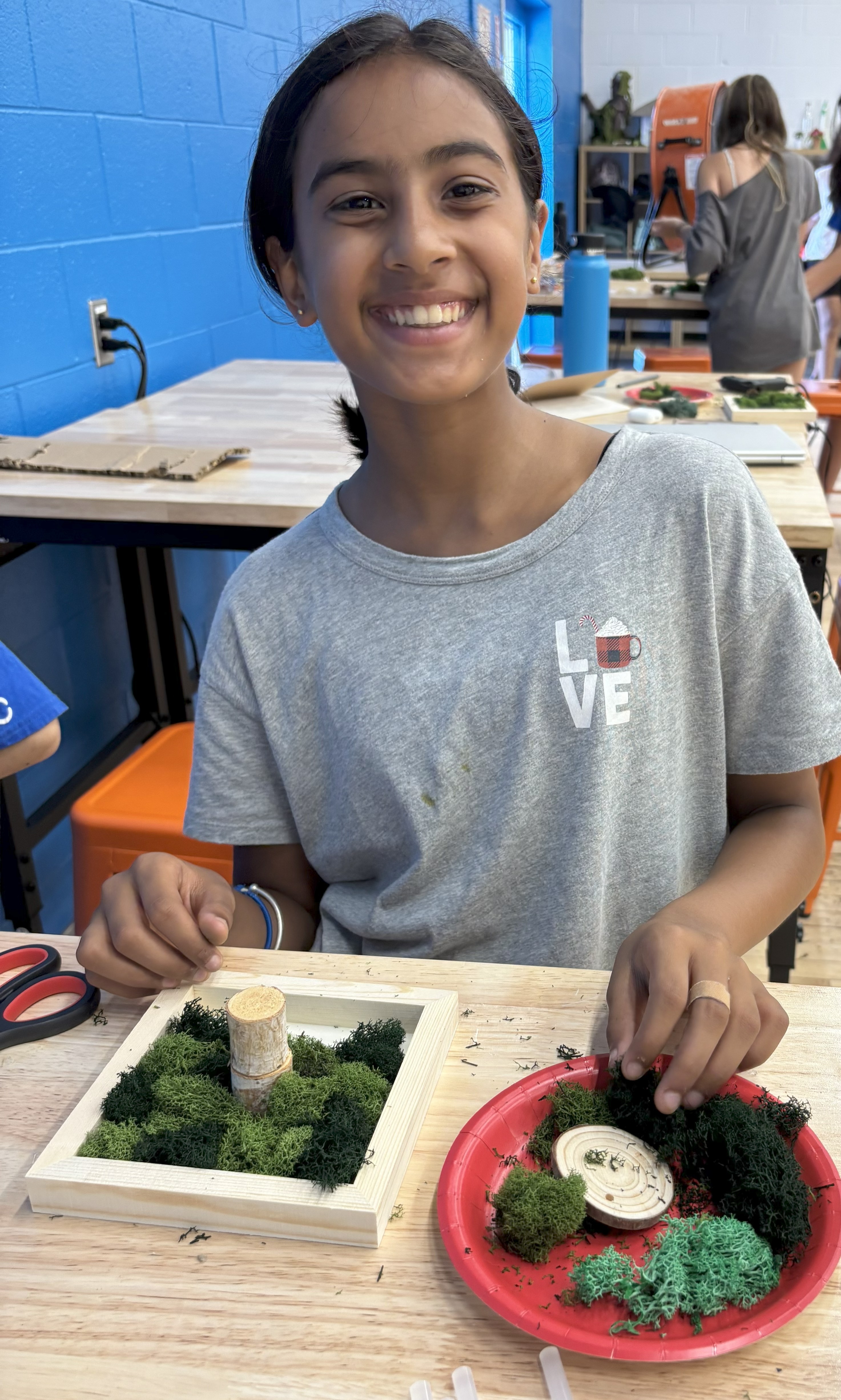 Student participating in InnovateHER camp activity