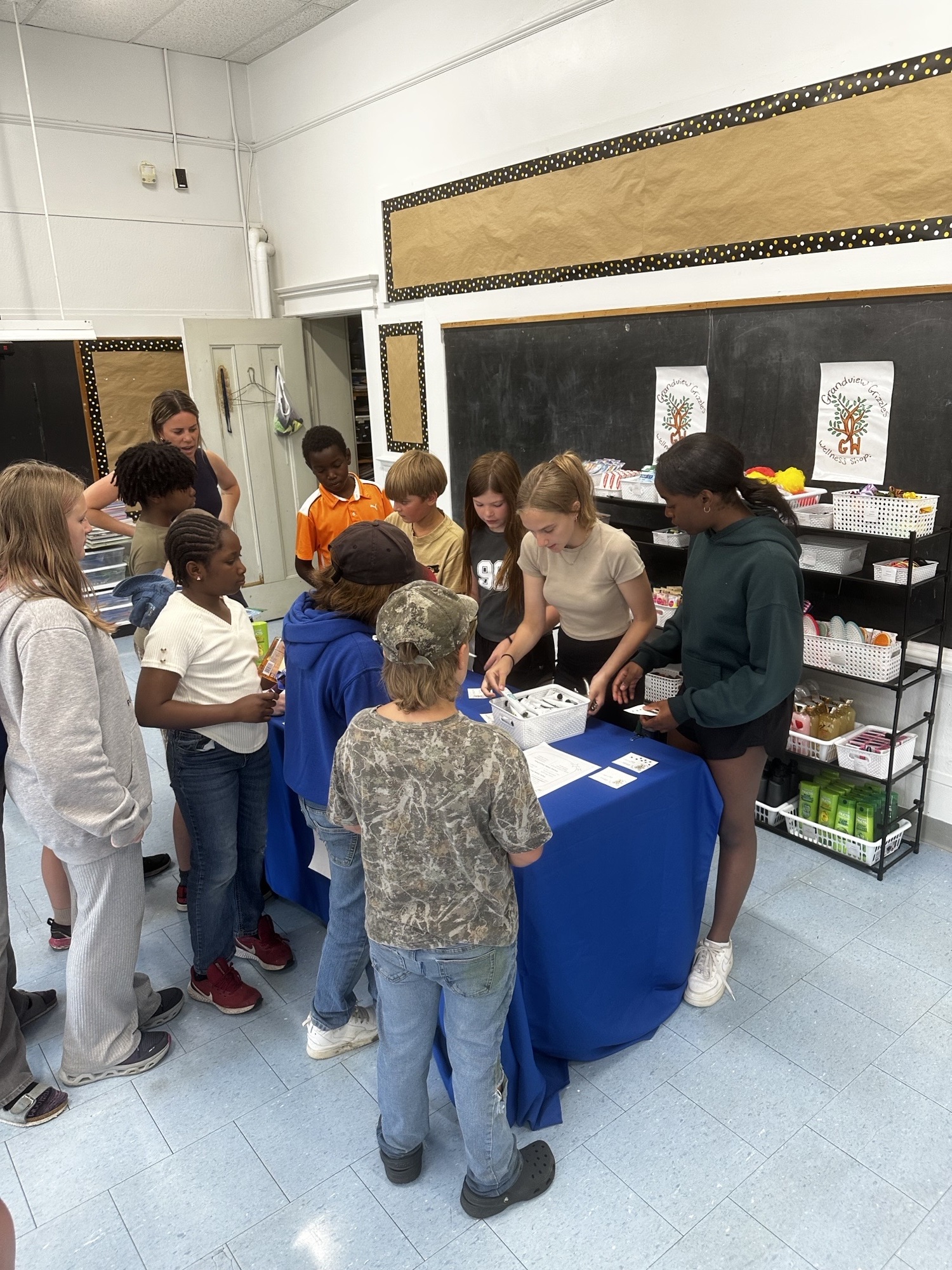 Students gathered around table at Wellness Tuck Shop