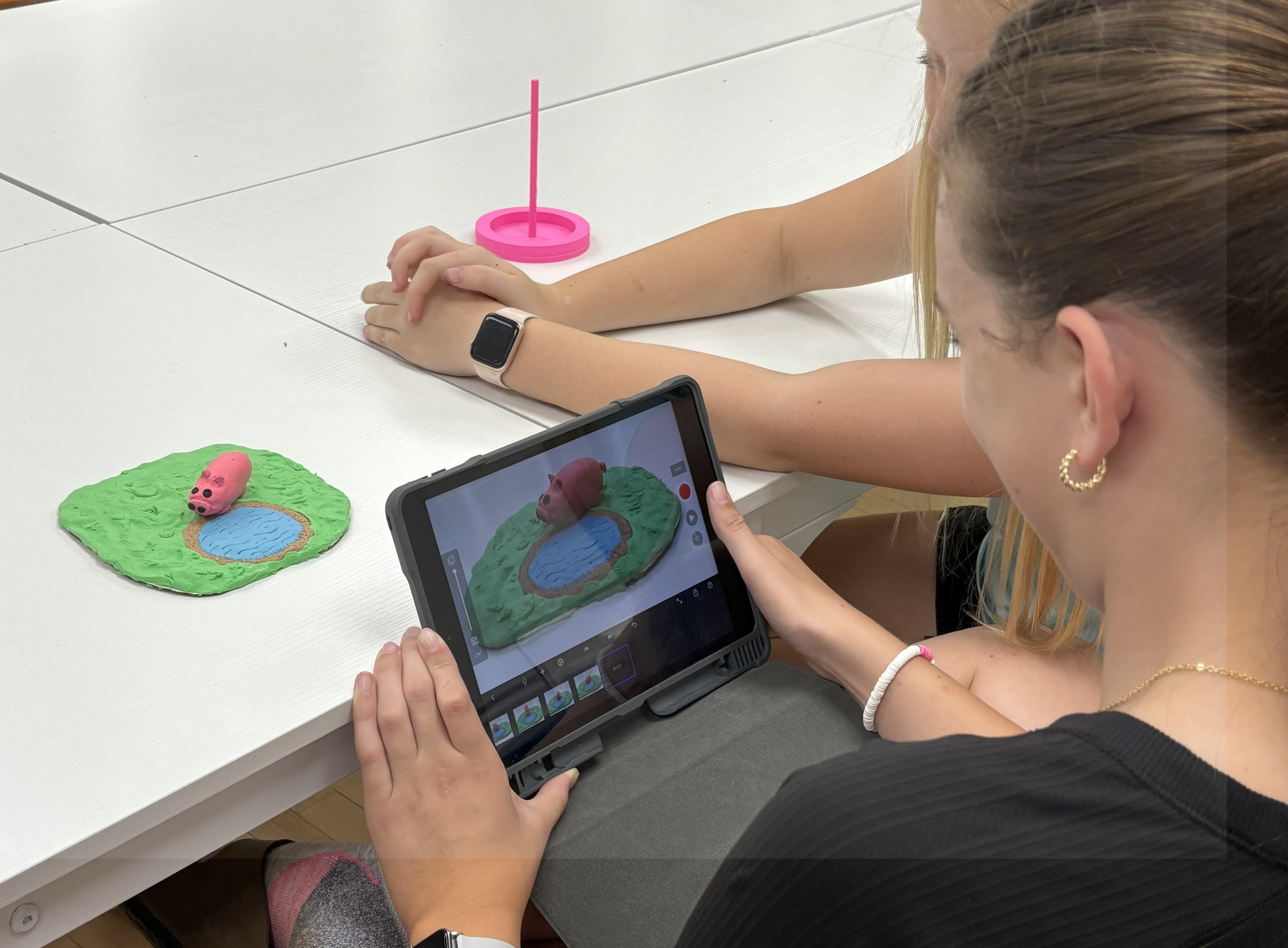 Campers using an I-pad to complete stop motion activity