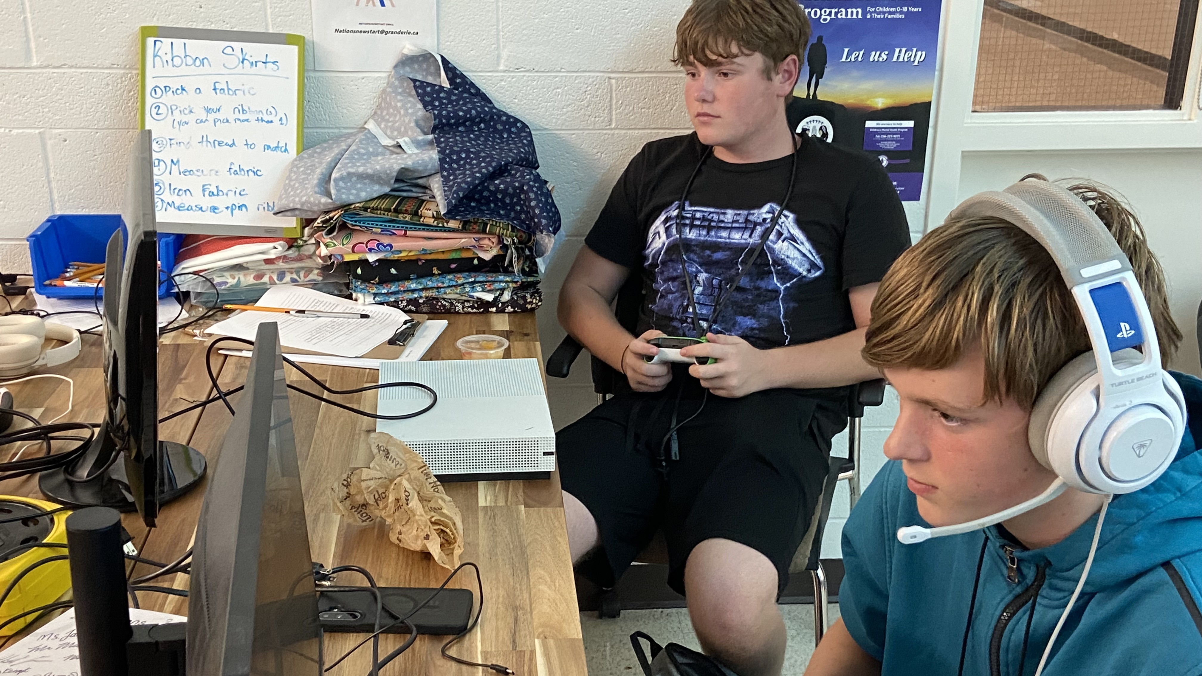 Students at desk playing esports