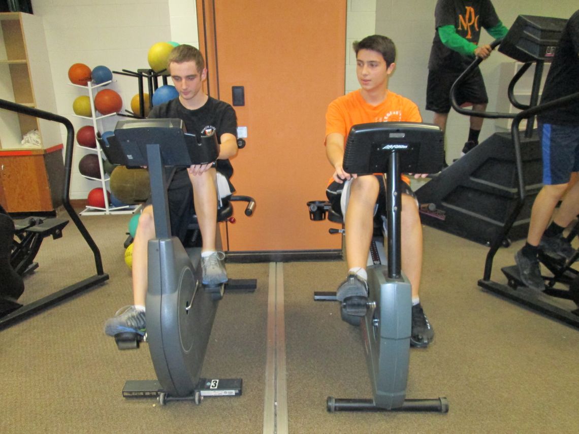 Students using an exercise bikes