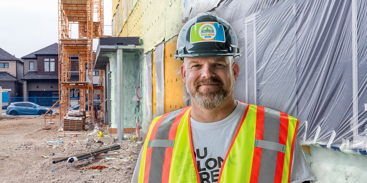Mark Fraser outside an in-construction Grand River Public School in early 2025