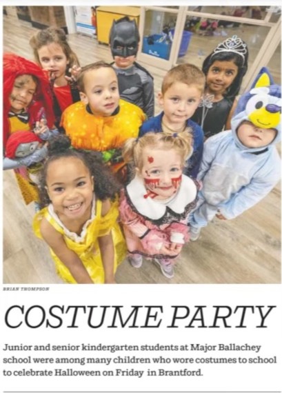 Children standing in Halloween costumes at Major Ballachey School